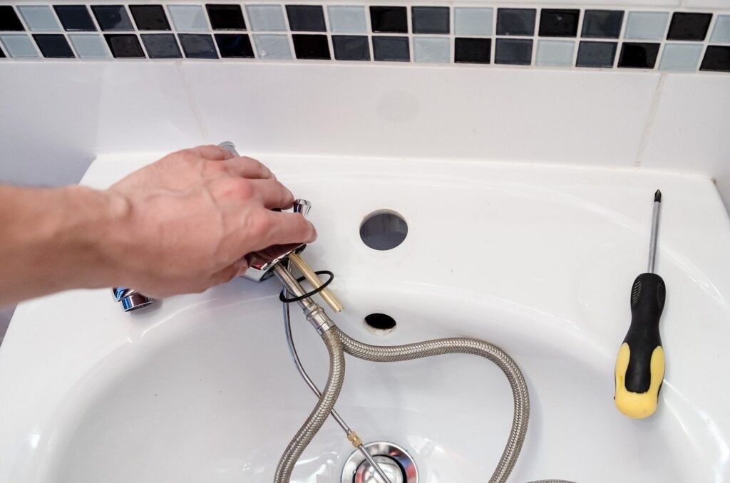 plumber fixing a tap